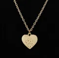 Polished gold heart pendant necklace featuring an animal paw print on O-chain link - Gold