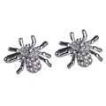 Macro shot of silver spider cufflinks featuring intricate sparkling rhinestone crystal pavé - White