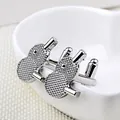 Silver bird shaped cufflinks with hammered metal texture on white ceramic surface - Ping Pong Racket Style (B1169)