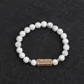 Howlite stone beaded bracelet featuring an antique bronze Powerful engraved metal plate - White Marble (Powerful)