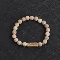 Beaded stone bracelet with Powerful engraved bronze plaque in earth tones - Mottled Beige (Powerful)