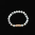 Beaded natural stone bracelet with spotted marble texture and bronze Forever charm - Sesame Jasper (Forever)