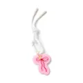 Pink acrylic pendant with red bow pattern featuring a white clasp and woven lanyard - Bow