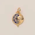 Detail of a celestial sun and moon charm with blue gems on a gold pendant - Sun Moon Pendant