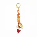 Detail of ceramic beaded bag charm with orange woven rope and red heart pendant - Heart Beaded Charm