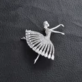 Sparkling silver ballet dancer brooch with pear-cut rhinestones on black leather background - Silver