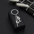 Porte-clés outils en métal argenté avec marteau et tournevis sur coffret - Style Clé Marteau Tournevis Et Chapeau De Cowboy (D1264)