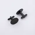 Close-up of polished black stainless steel cufflinks with classic T-shaped toggle closure - Oval Black