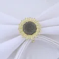 Golden sunflower napkin ring with black textured center on a white fabric background - Gold Sunflower with Black Center (Z1044-1)