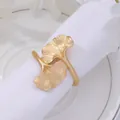 Elegant gold ginkgo leaf napkin ring on white linen for luxury dining and wedding table decor - Matte Gold