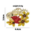 Christmas reindeer napkin ring in gold alloy with red rhinestones and yellow enamel leaves - Golden Reindeer Style (Z1080)