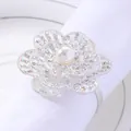 Silver flower napkin ring with sparkling crystals and a white pearl center for elegant decor - Iridescent Rhinestones