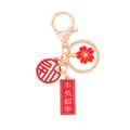 Chinese style gold keychain with red charms and Fu character blessing tags - Cherish Youth