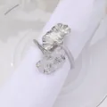 Elegant silver ginkgo leaf napkin ring with detailed metallic texture on white plate - Bright Silver