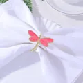 Macro detail of a golden dragonfly napkin ring with pink enamel on a white linen napkin - Rose Pink (Z1059-4)