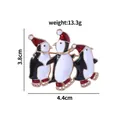 Three cute Christmas penguin brooches in red skating shoes made of enamel and alloy - Three Skating Penguins (C2116-9)