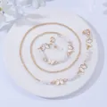 Detail view of gold glasses chain with white enamel butterfly pendants and pearls - Butterfly White
