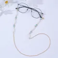 Detail of eyewear chain with blue enamel butterflies, pearls and gold link chain - Light Blue Butterfly