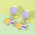 Detail of glitter purple clip-on earrings for kids featuring a cute colorful shooting star - Shooting Star