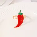 Portatovaglioli a forma di peperoncino rosso con sorriso su piatto di ceramica bianca - Forma di Peperoncino Rosso