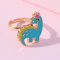 Bague réglable dorée pour enfant avec mignon dinosaure bleu ciel et couronne rose - Dinosaure à Couronne Bleue (E1209-21)