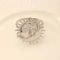 Silver celestial napkin ring featuring artistic sun and moon face design for dining table - Z1190-3