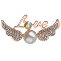 Macro shot of rose gold angel wing brooch with pearls, crystals and Love text engraving - Angel Wings Love (C1045)