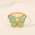 Servilletero de mariposa dorada con alas de mármol verde y detalle de perla - Verde