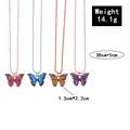 Detail of colorful butterfly necklaces in rose, blue, orange and purple enamel pendant set - Four Color Gradient Bead Chain Set