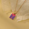 Golden chain necklace with purple gift box pendant and pink bow on textured background - Purple Gift Box Bow (A2889-12)