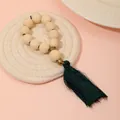 Handmade wooden bead napkin ring featuring long dark green tassel and vintage gold accents - Wood Bead Green Tassel Style (Z1204)