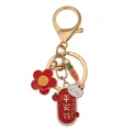 Golden Chinese zodiac rabbit keychain with lucky charm tag and red floral pendant - Safety Charm (D1360)