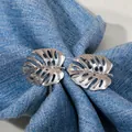 Polished silver monstera leaf napkin rings in stainless steel set of two pieces - Silver