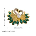Elegant gold-tone swan brooch with green crystals and white pearl, size measurements shown - Double Swan Heart Style with Green Faux Gemstone (C2322)
