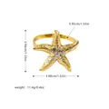 Servilletero de estrella de mar dorada con cristales brillantes para mesa náutica - Estrella de mar