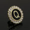 Luxury round brooch with golden letter Q and sparkling crystal rhinestones on black enamel - C2173-Q Brooch