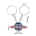 Planet couple keychain in pink and blue enamel with interlocking heart puzzle design - Pink Blue Purple Striped Starry Style (D1389-1)