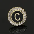 Golden round rhinestone brooch with black enamel and letter C for business suits - C2173-C Brooch