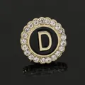 Letter D gold brooch with black inlay and sparkling crystals on reflective background - C2173-D Brooch