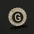 Elegant gold round brooch with black enamel, crystal rhinestones, and letter G detail - C2173-G Brooch