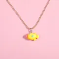 Close-up of a yellow cartoon fish pendant with a gold bead chain on pink background - Yellow Small Fish Style (A3046-3)