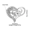 Silver hollow heart napkin ring with sparkling rhinestones and a large crystal center - Hollow Heart Rhinestone Style (Z1316)