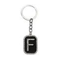 Llavero de estilo hip hop con letra F y brillantes diamantes sobre fondo negro - Letra F