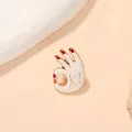 Detailed close-up of a white enamel OK gesture brooch with red nails and gold trim - OK Gesture Style (C1102)