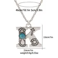 Macro shot of silver letter K pendant with turquoise inlay and boho carvings detail - A3217-K