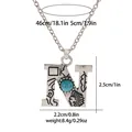 Detail view of retro silver necklace with turquoise bead and engraved tribal pattern - A3217-N