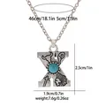 Macro view of vintage silver X-letter pendant with turquoise and western motifs - A3217-X