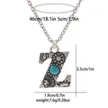 Macro shot showing detailed carvings and turquoise stone on the vintage letter Z pendant - A3217-Z