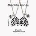 Detail of zebra BFF pendant necklaces featuring black and white enamel and dimensions - Zebra Stitching Style (A3274)
