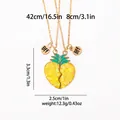 Detail view of gold BFF heart pineapple necklaces with yellow sequins and green enamel - Pineapple Heart Magnetic Style (A3158)